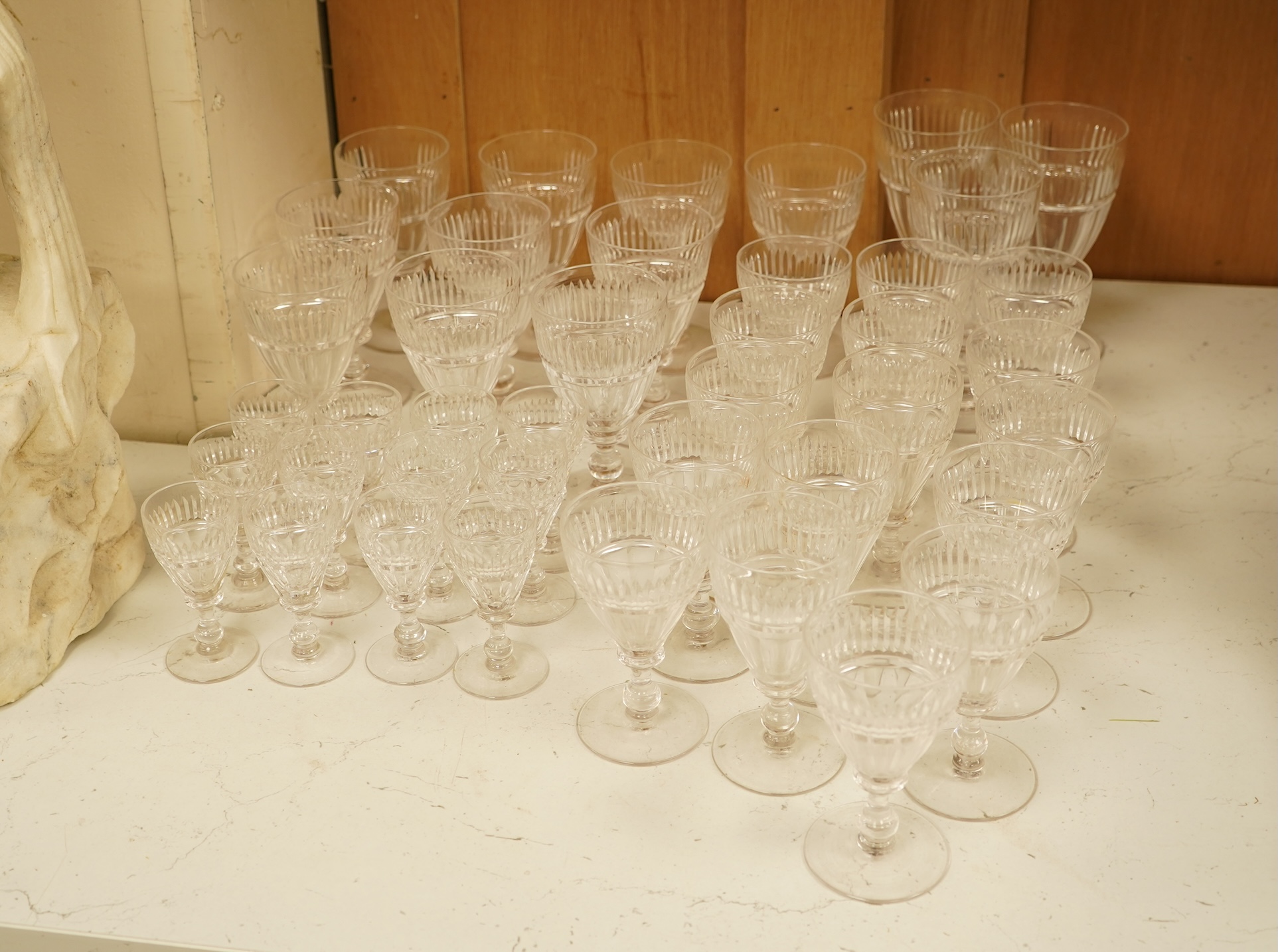 A part suite of 19th century cut glass drinking glasses, largest 13cm high